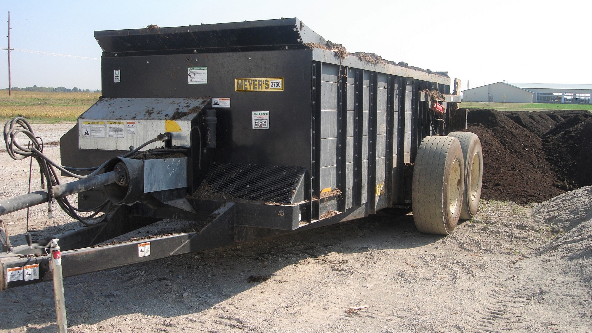 Waggon for placing separation solids in windrows at an Iowa cattle farm. 